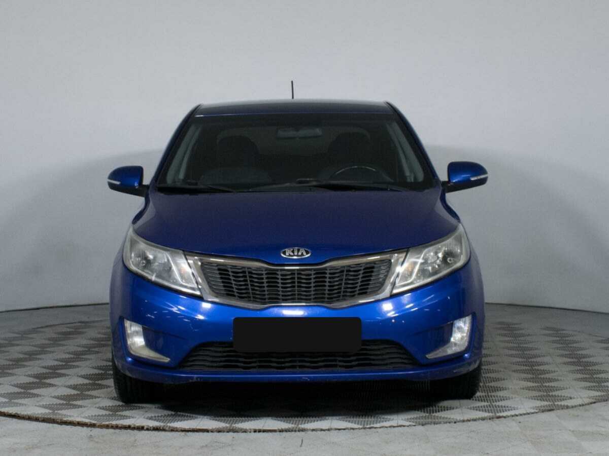 Kia Rio с пробегом — 2013 год. Фото: #1