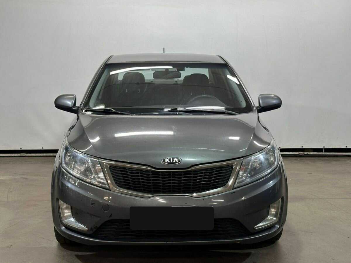 Kia Rio с пробегом — 2013 год. Фото: #1