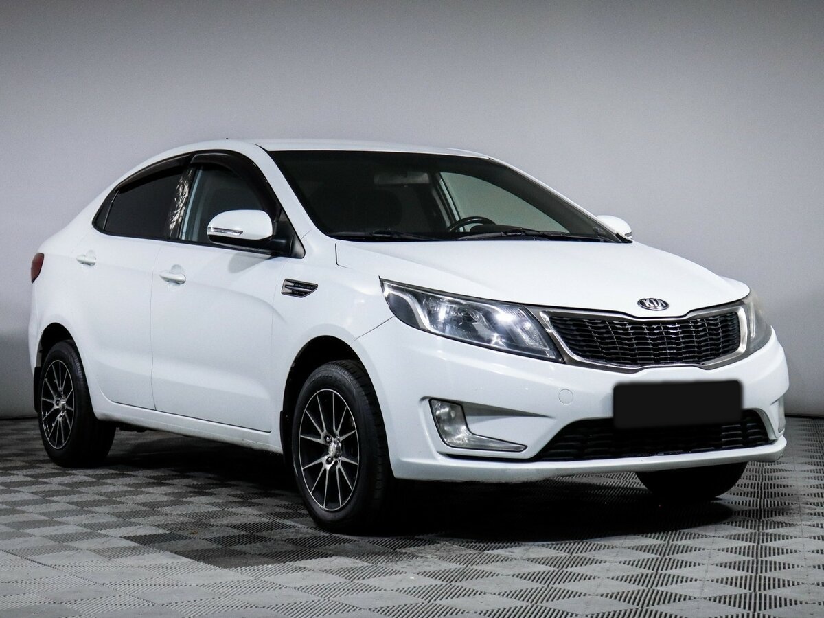 Kia Rio с пробегом — 2013 год. Фото: #2