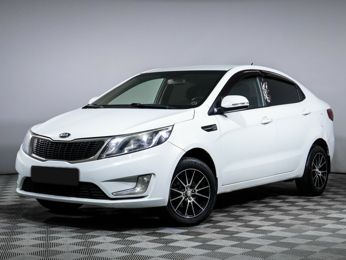 Kia Rio с пробегом — 2013 год. Фото: #0